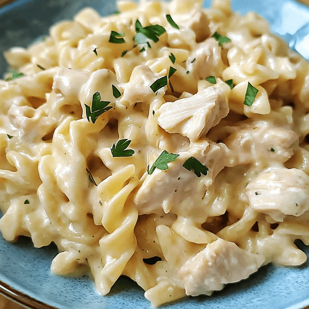 Creamy chicken and pasta with parsley topping.