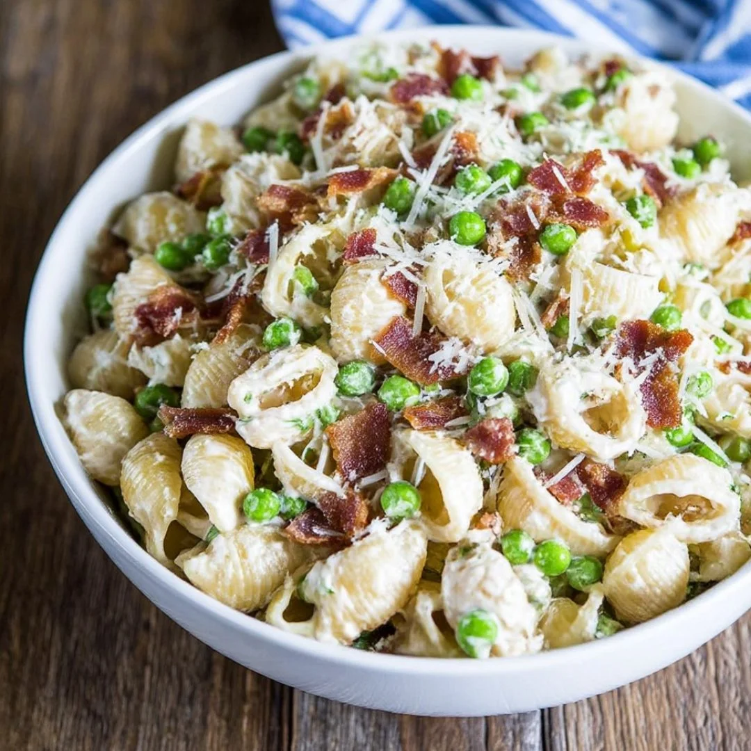 Delicious creamy pasta salad served in a bowl with fresh vegetables