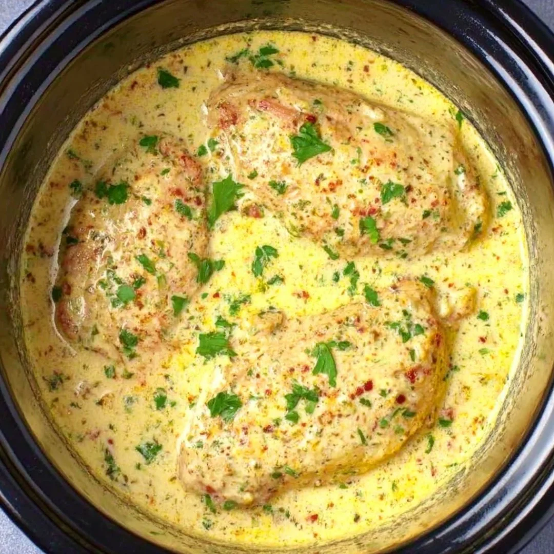 Delicious Crock Pot Angel Chicken recipe ready to serve with herbs and spices.