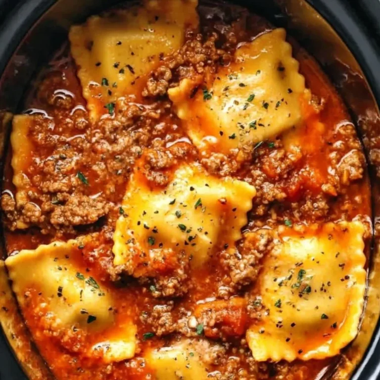 Crockpot Ravioli Lasagna dish ready to serve, showcasing layers of pasta and cheese.