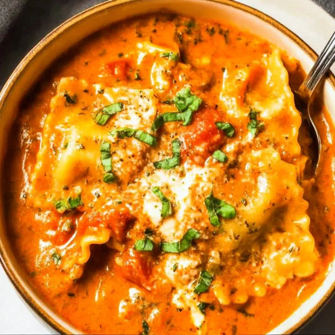Delicious bowl of Easy Creamy Lasagna Soup topped with fresh herbs