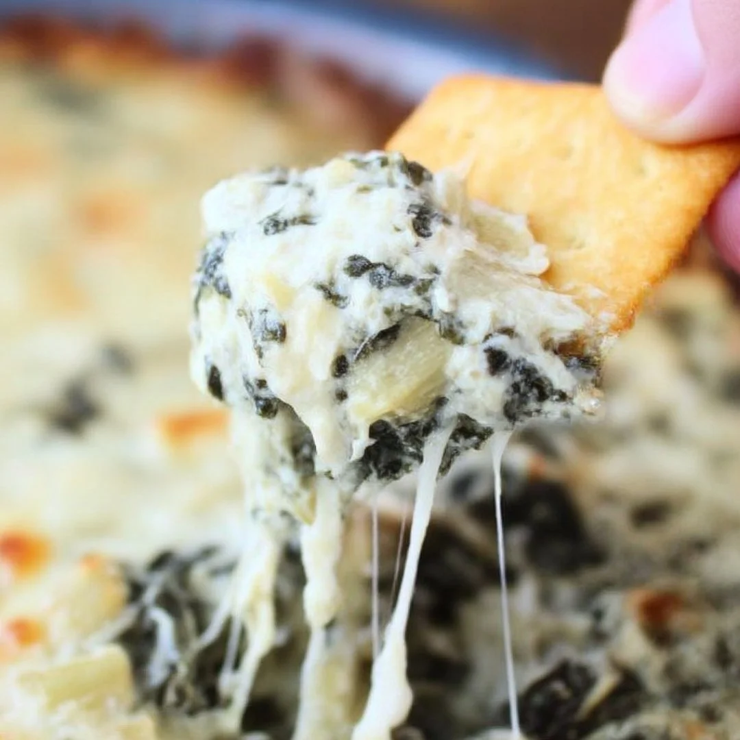 Creamy spinach and artichoke dip served with tortilla chips