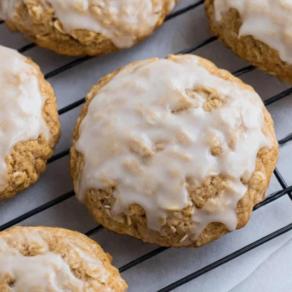 Delicious iced oatmeal cookies, inspired by Crumbl's recipe, ready to enjoy.