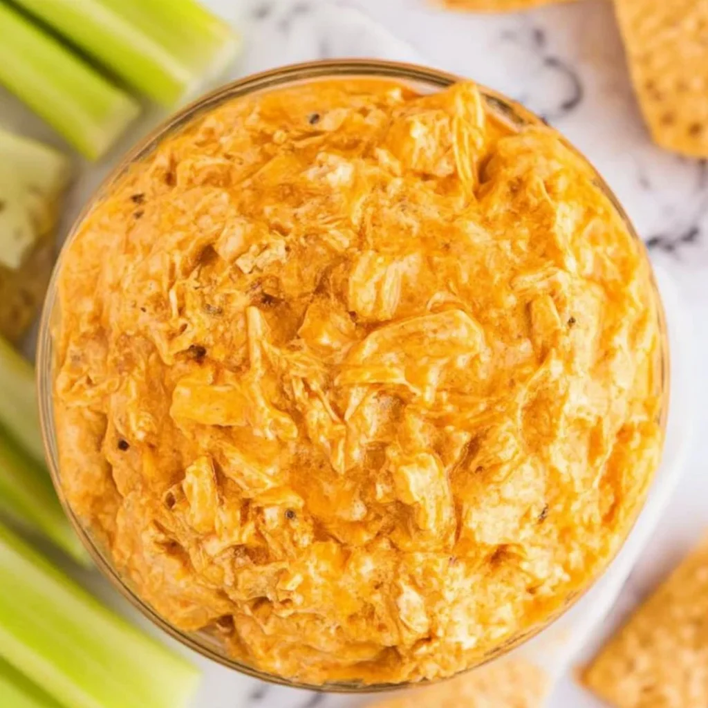 Creamy slow cooker buffalo chicken dip served with tortilla chips