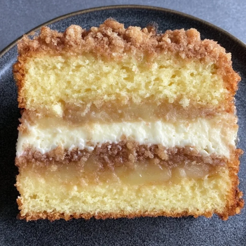 Delicious Apple Crumble Cake with Cream Cheese Filling ready to serve.