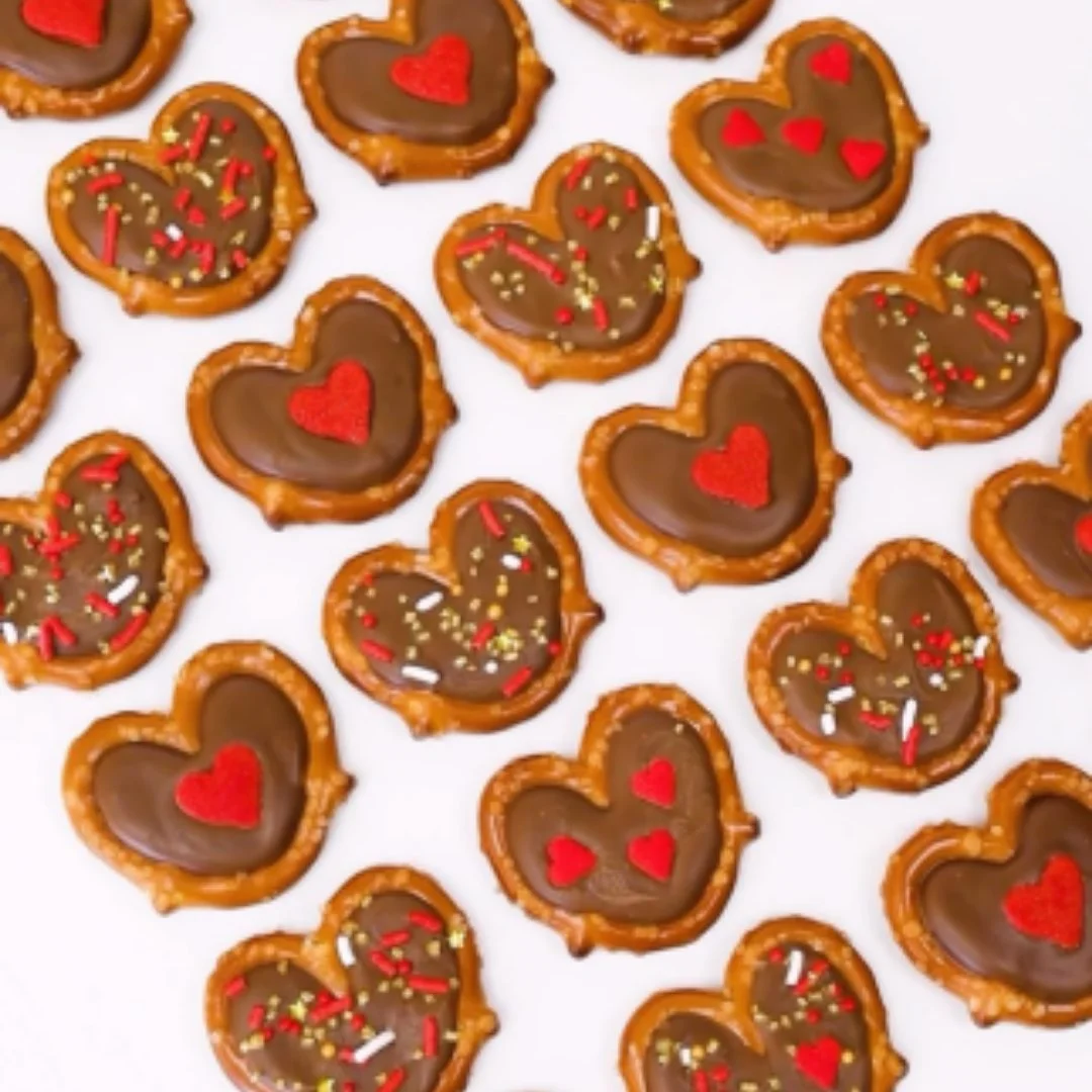 Delicious chocolate covered pretzels on a rustic wooden table