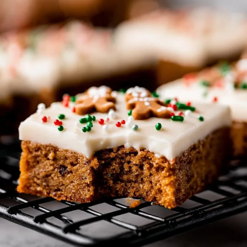 Delicious Gingerbread Cookie Bars topped with icing and festive decorations