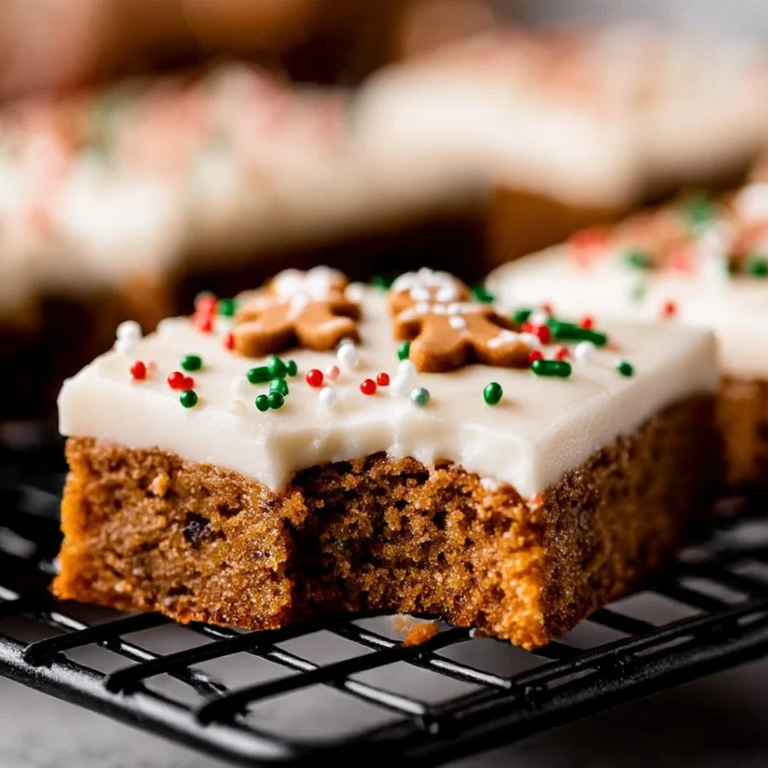 Delicious Gingerbread Cookie Bars topped with icing and festive decorations