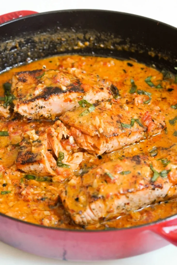 Deliciously cooked Marry Me Salmon garnished with herbs and citrus