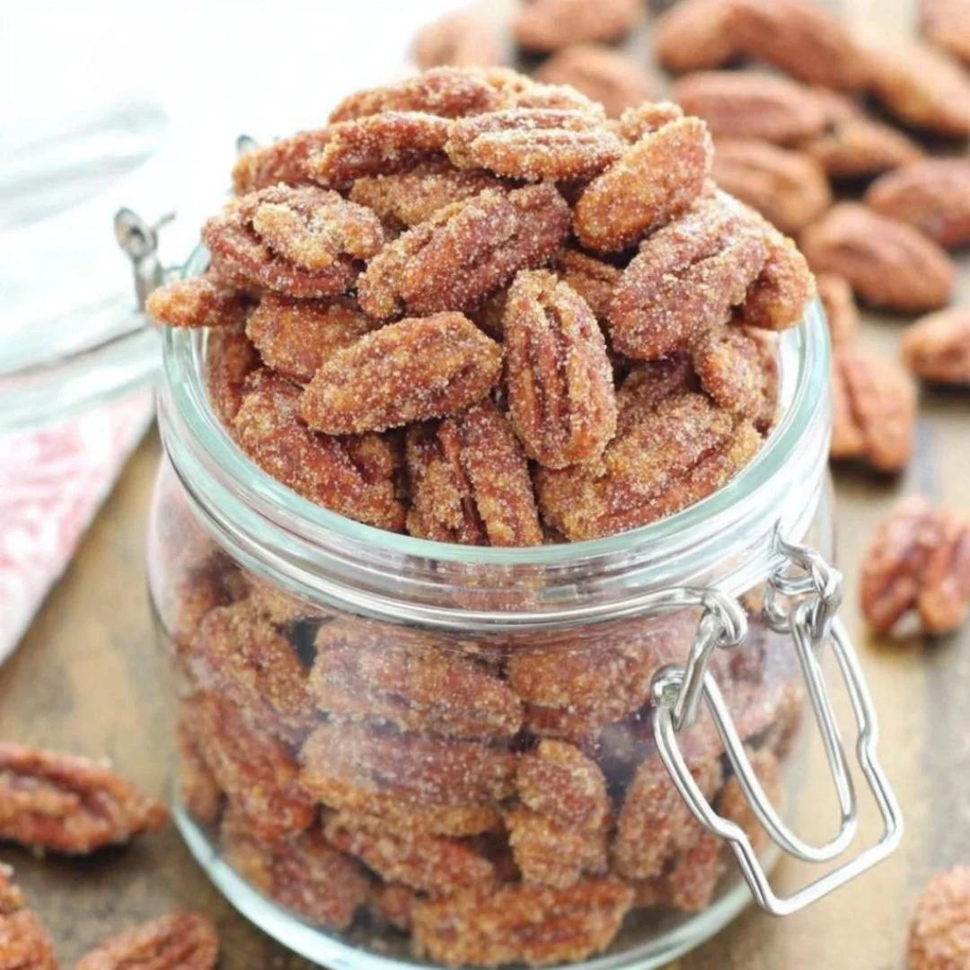 Delicious sweet pecan pie with a golden crust and crunchy pecans on top.