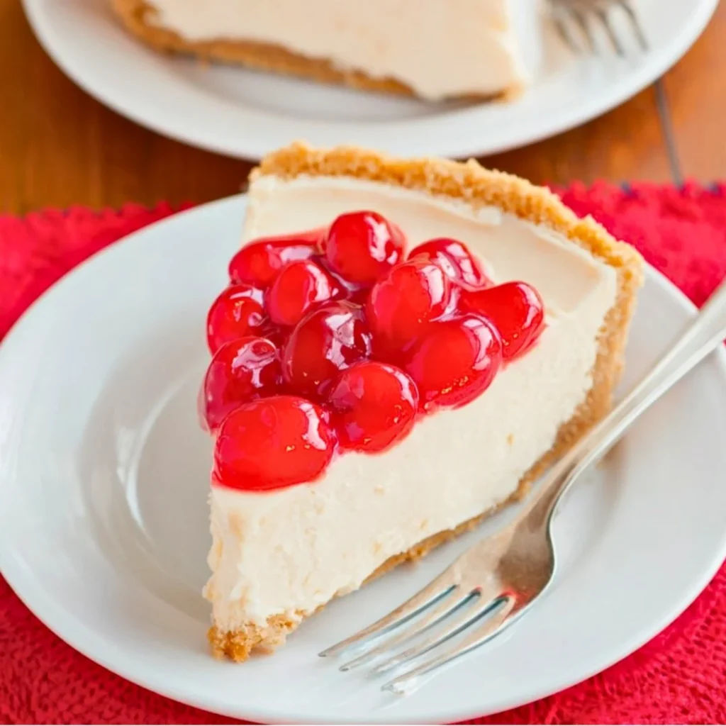 Slice of easy vegan cheesecake topped with fresh berries