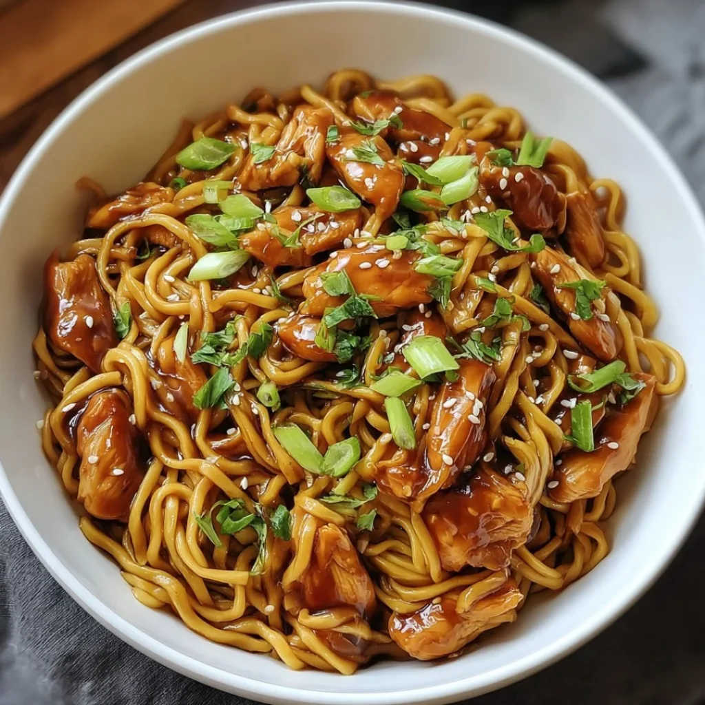 A bowl of spicy pumpkin soup topped with herbs and served with bread