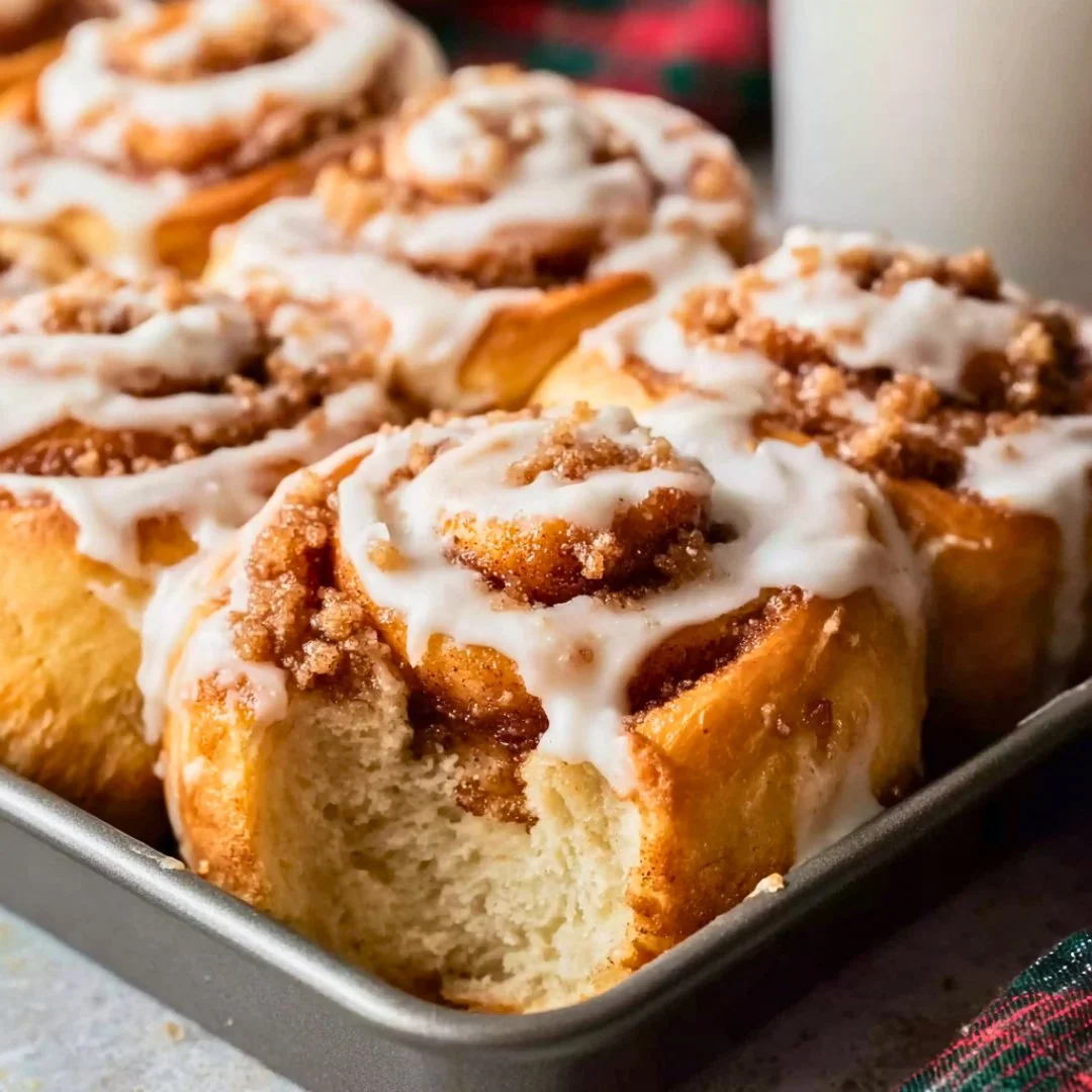 Freshly baked brown butter cinnamon rolls with gooey cinnamon filling and icing