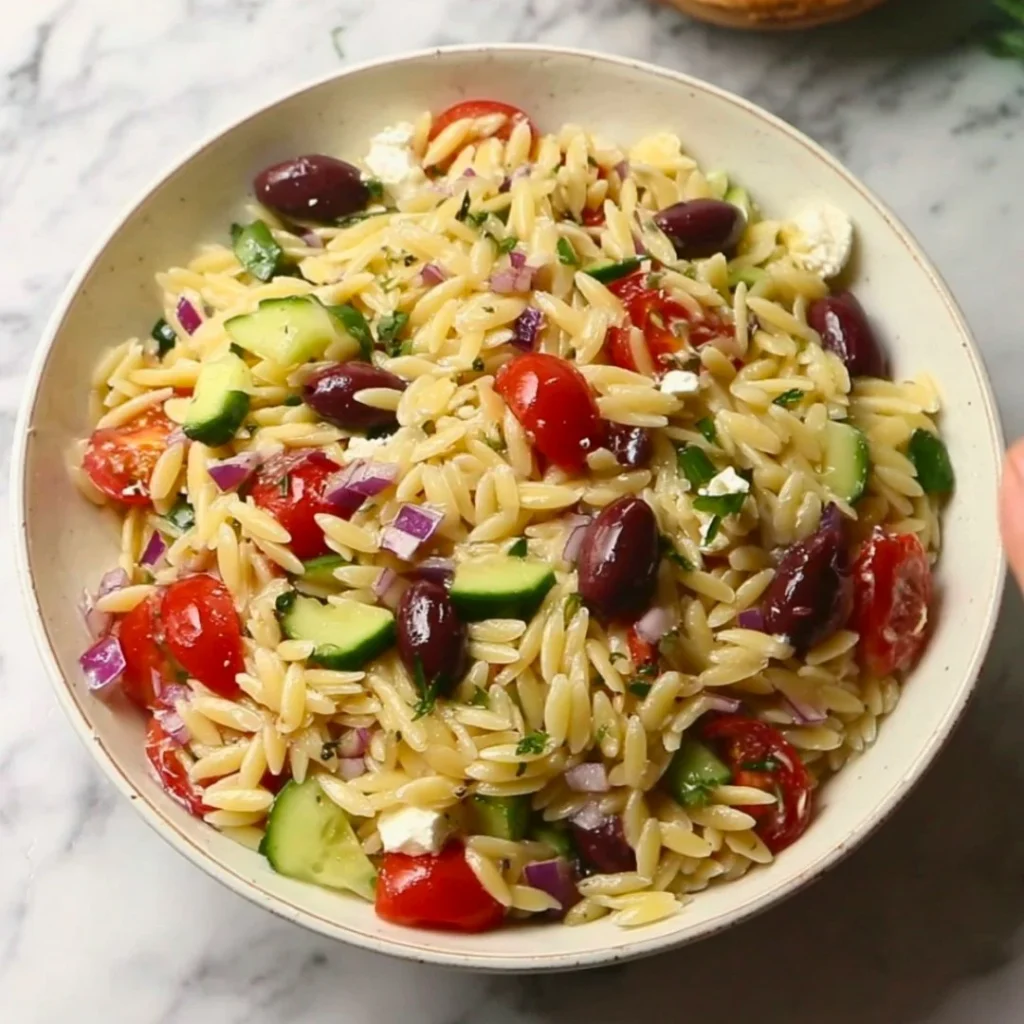 Fresh Greek Orzo Salad with vegetables and feta cheese