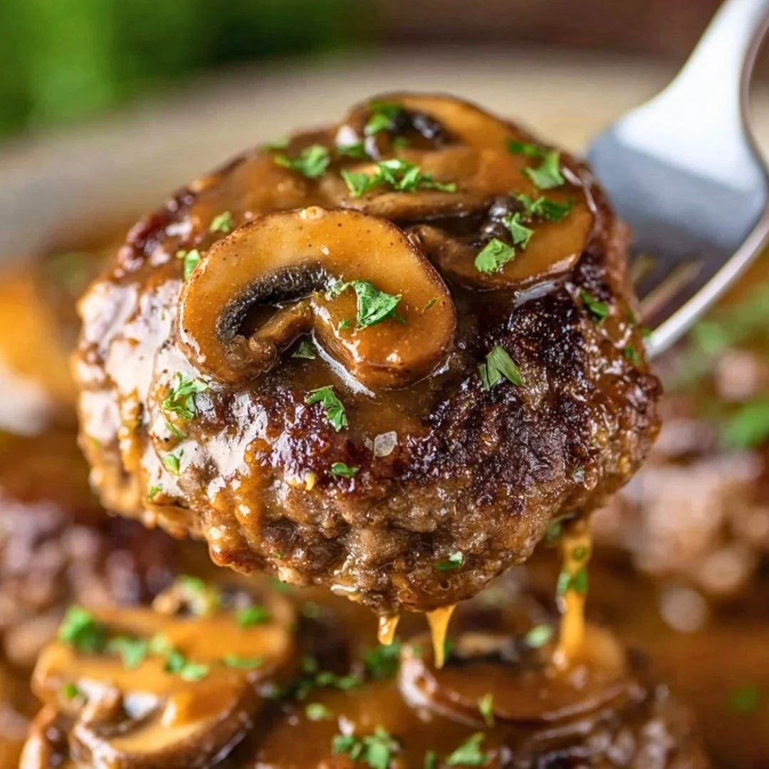 Delicious homemade Salisbury steak recipe served with gravy and mashed potatoes