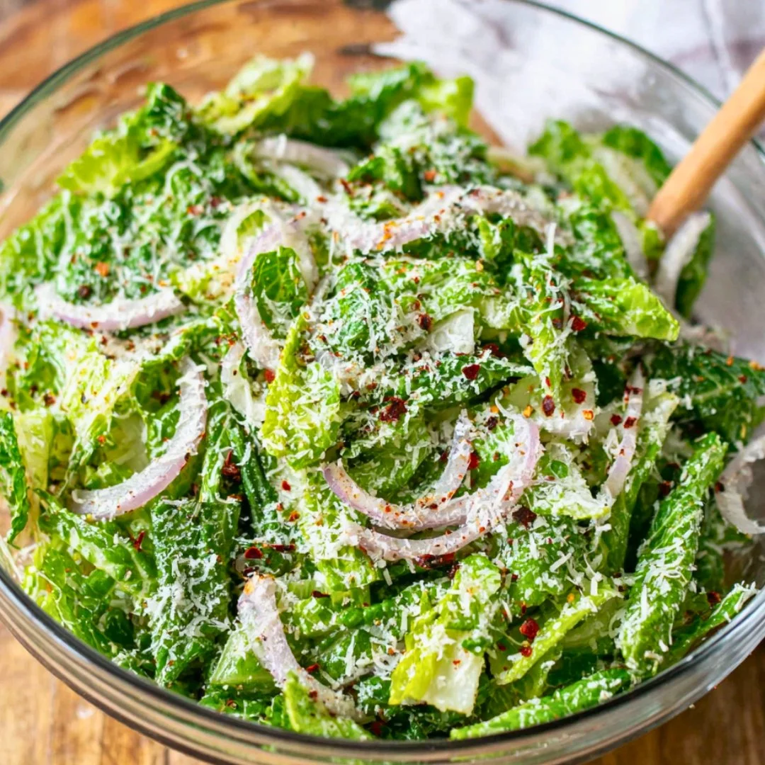 Fresh Lemon Parmesan Salad with greens, lemons, and grated Parmesan cheese