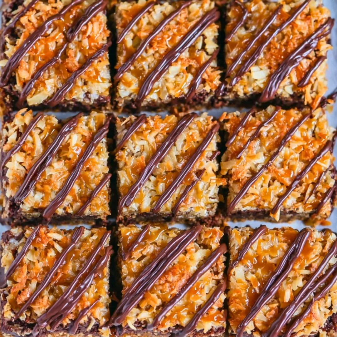 Decadent Samoa Brownies topped with caramel and coconut flakes