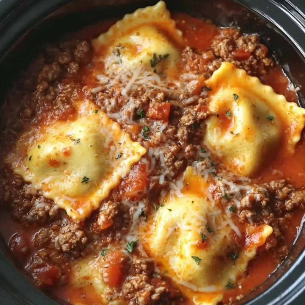Delicious Crockpot Ravioli Lasagna served in a skillet with cheese and sauce