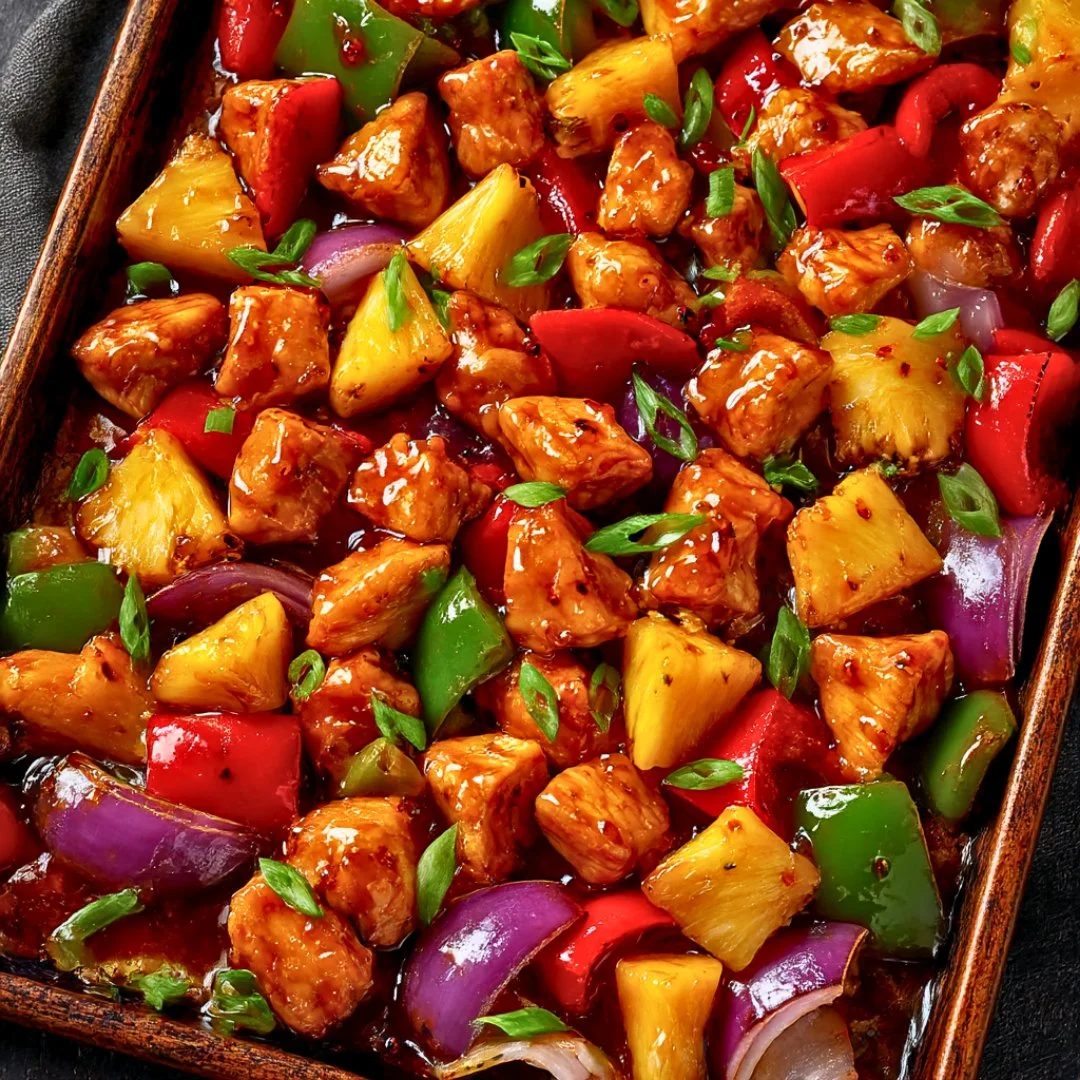 Delicious Hawaiian Chicken Sheet Pan dinner with vibrant vegetables and pineapple.
