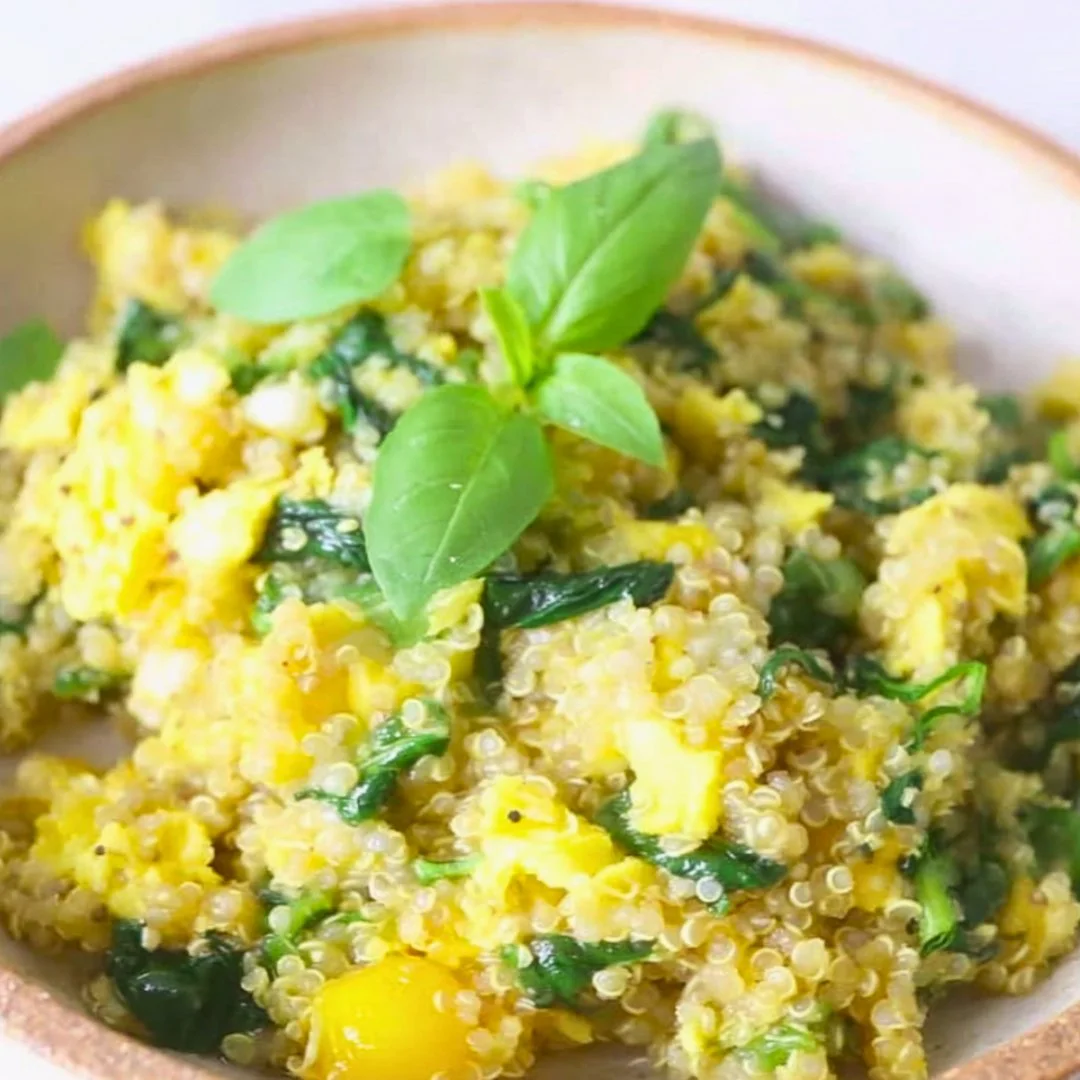 High protein healthy egg scramble with quinoa served in a bowl