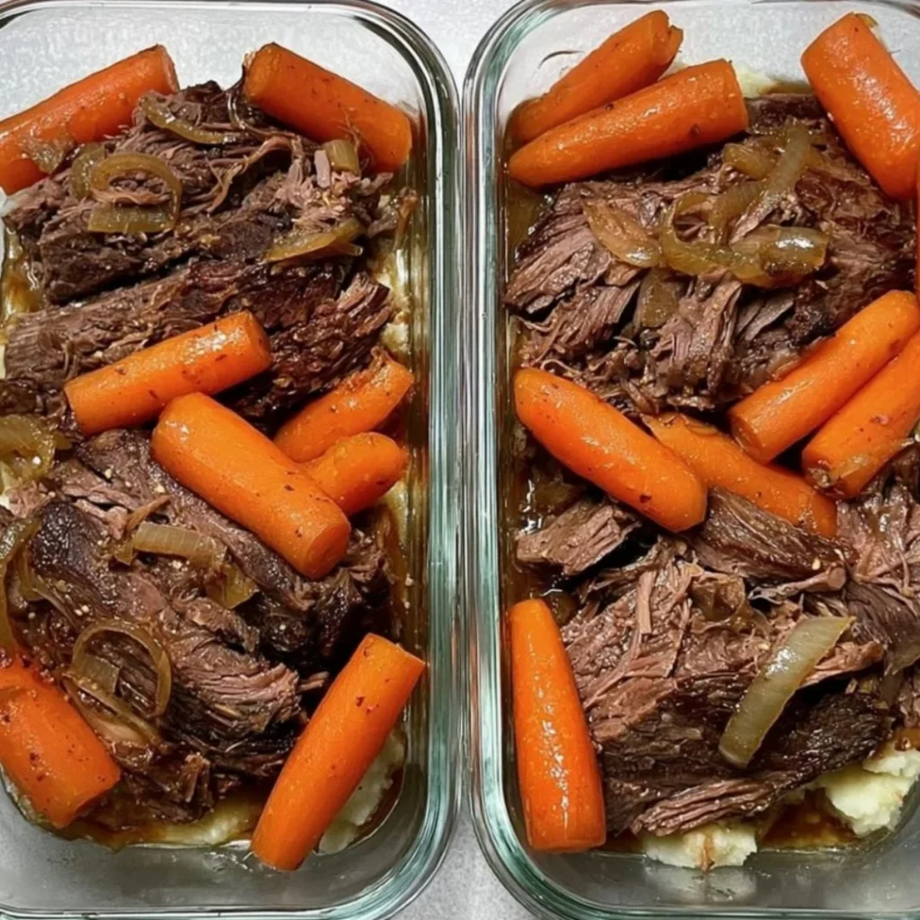 A deliciously tender pot roast served with vegetables on a rustic wooden table.
