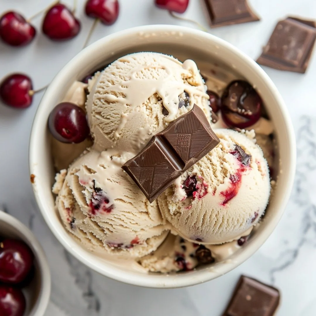 Scoop of Cherry Garcia ice cream with cherries and fudge chunks