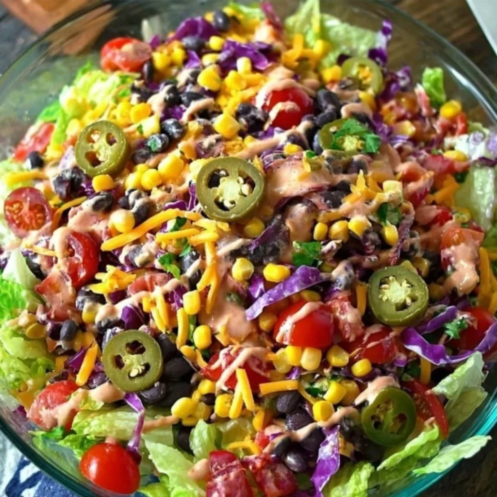 Delicious cow salad covered in creamy dressing and topped with tasty ingredients.
