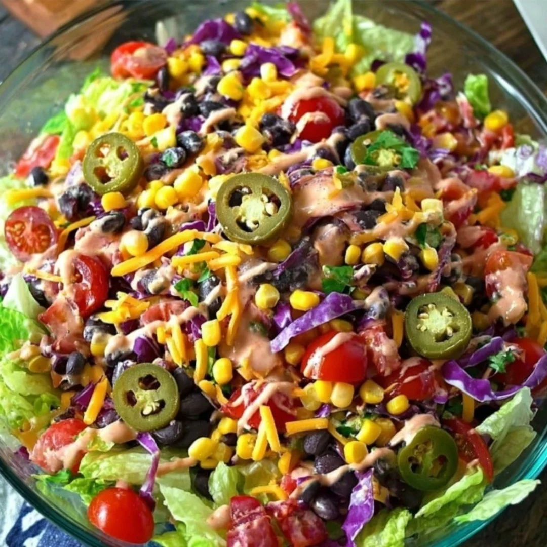 Delicious cow salad covered in creamy dressing and topped with tasty ingredients.