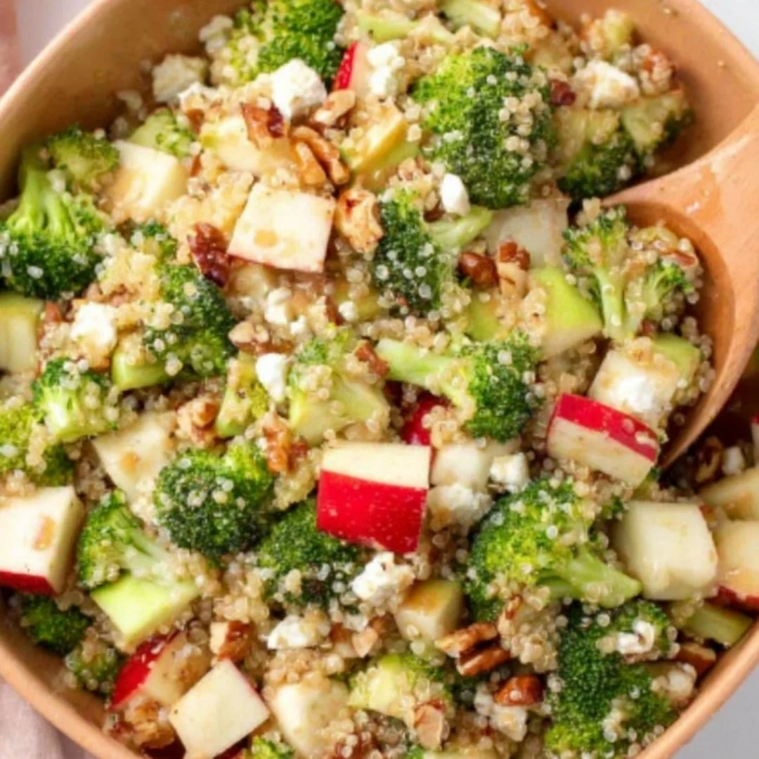 Healthy broccoli apple quinoa salad with fresh ingredients and vibrant colors