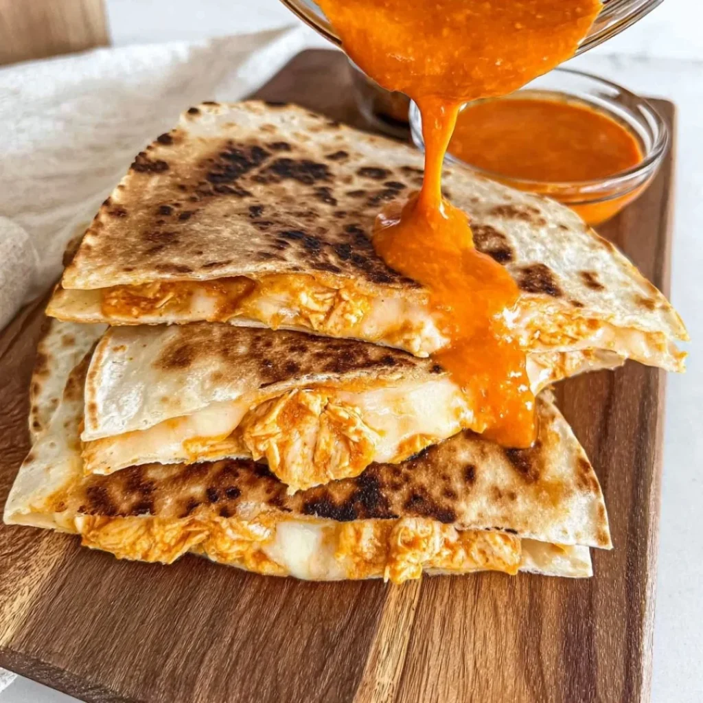 Cheesy Buffalo Chicken Quesadillas with melted cheese and spicy chicken filling