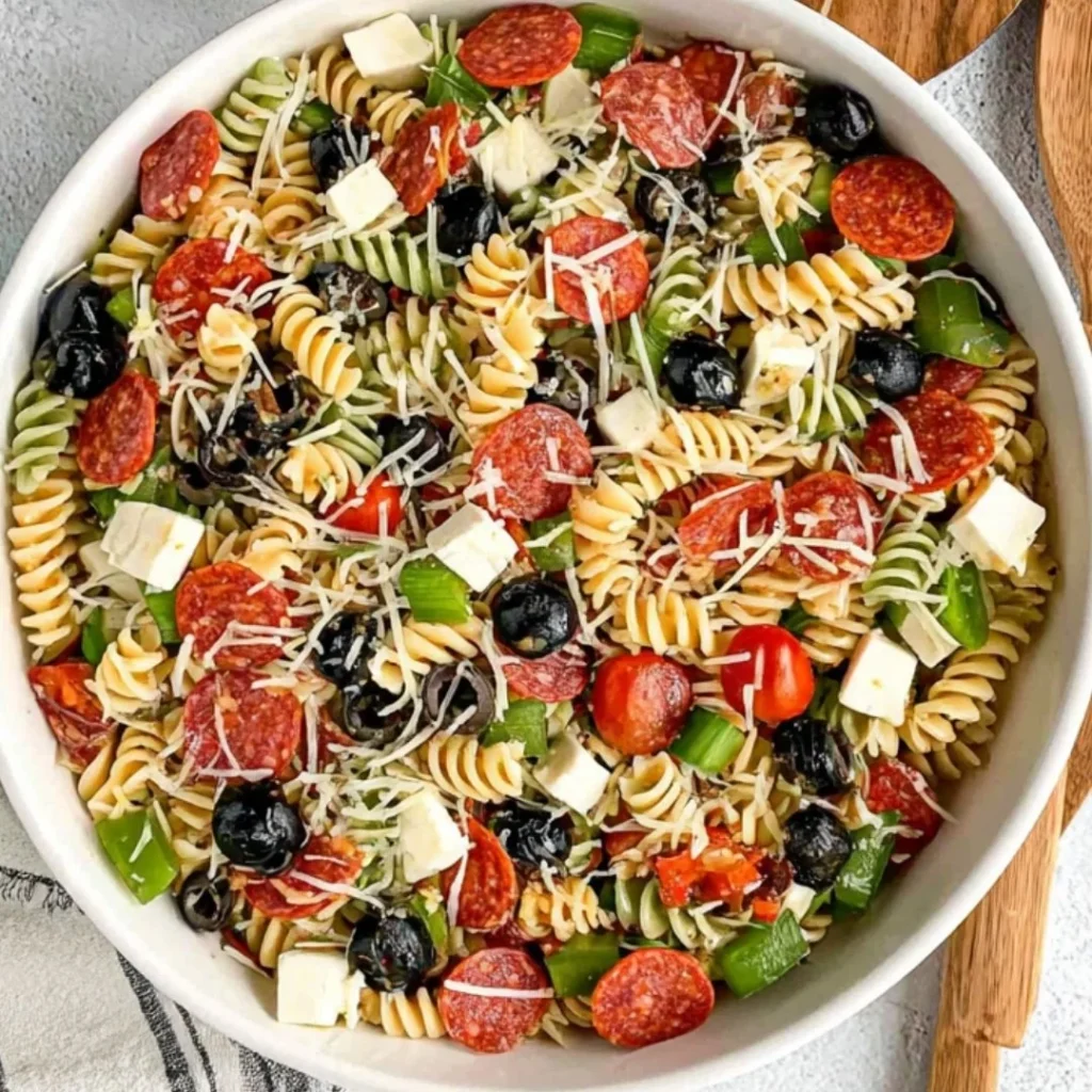 Colorful and fresh Italian Pasta Salad with vegetables and dressing