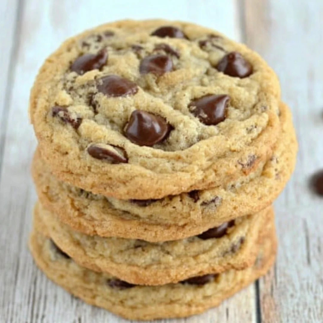 Freshly baked chewy banana chocolate chip cookies on a cooling rack
