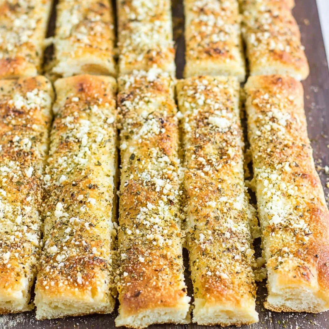 Delicious homemade copycat Pizza Hut Breadsticks served with marinara sauce.