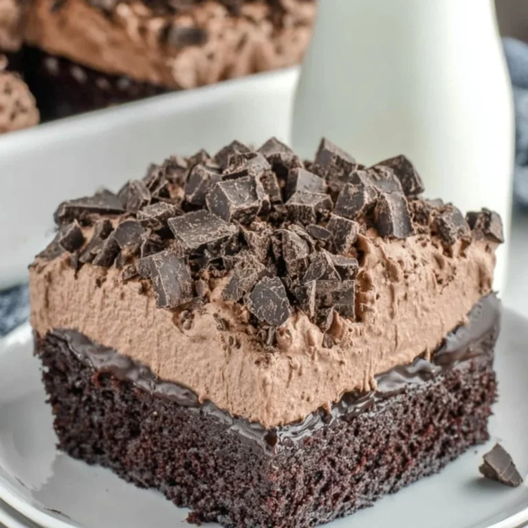 Death By Chocolate Poke Cake with chocolate frosting and toppings