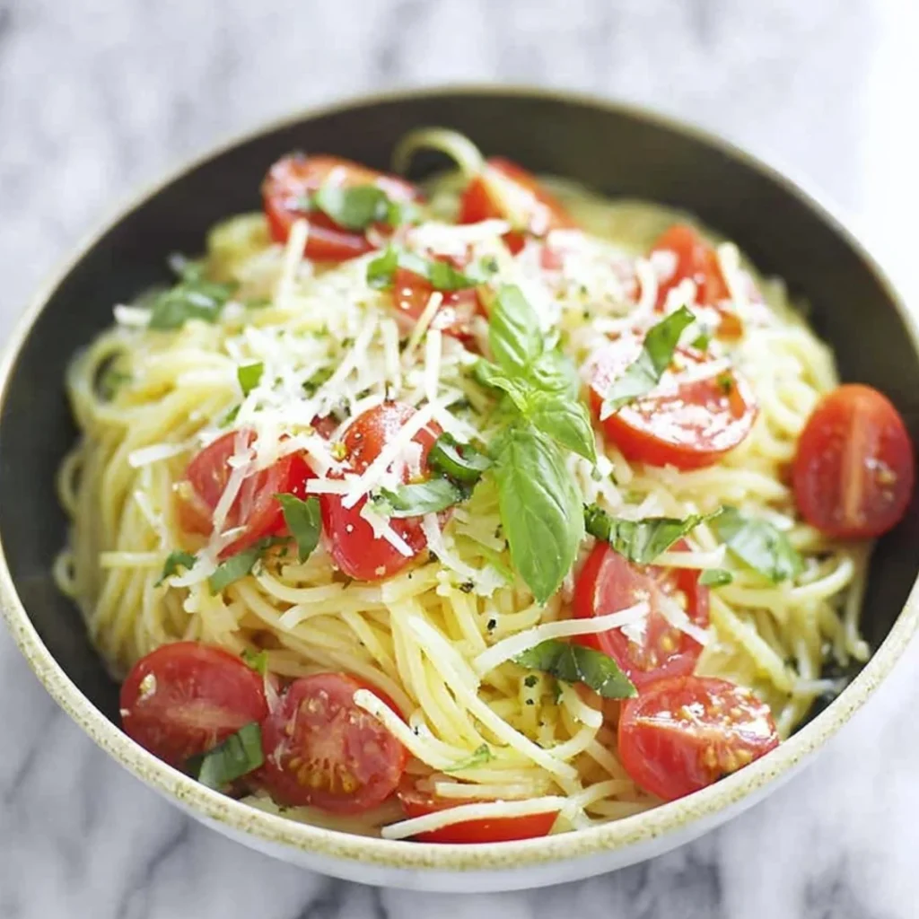Plate of Lemon-Basil Spaghetti garnished with fresh basil and lemon zest