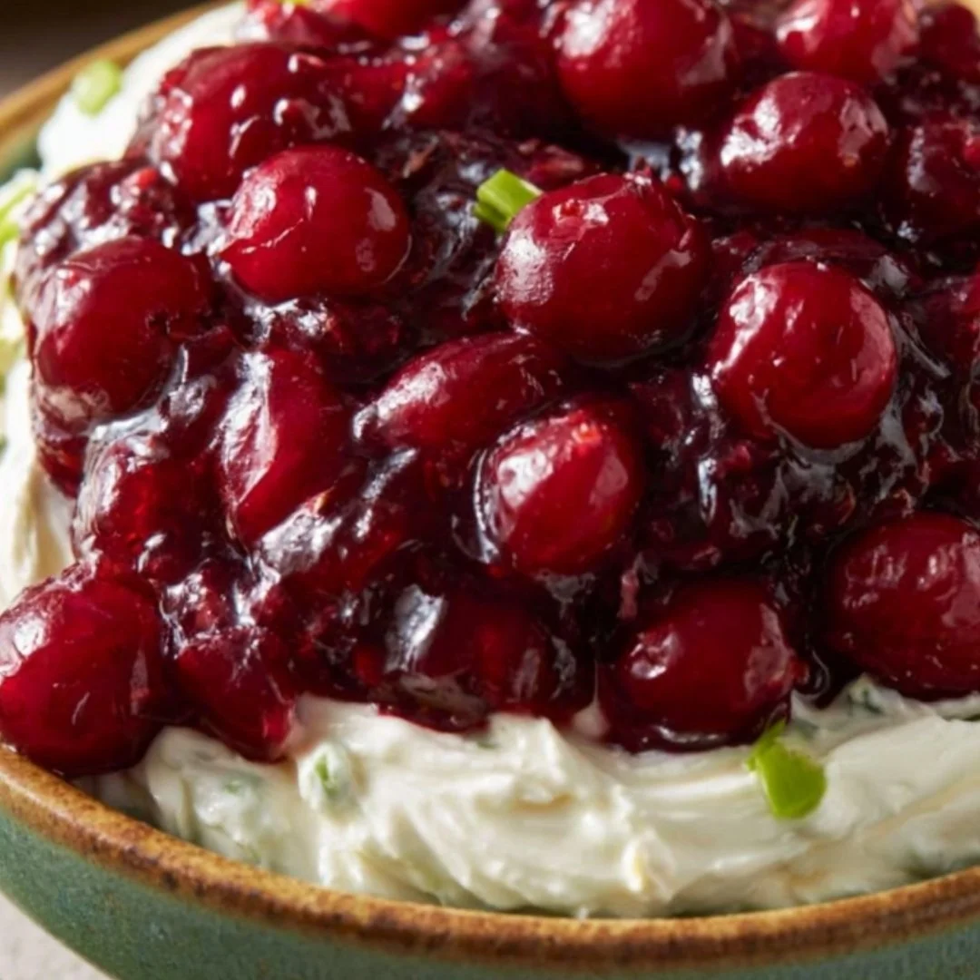 Sweet and spicy cranberry jalapeno dip served in a bowl