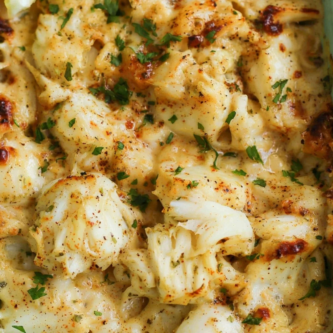Delicious baked crab imperial dish topped with herbs and baked to perfection