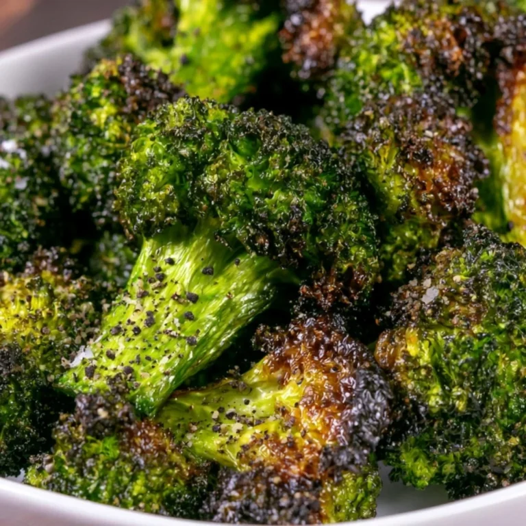 Crispy Air Fryer Broccoli served on a plate with seasoning